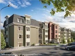 Canton apartment for rent - A street view of a residential area with apartment buildings.