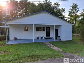 Warrenton apartment for rent - A white house with a porch and a covered patio.