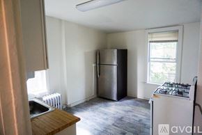 Philadelphia apartment for rent - A kitchen with a stove, refrigerator, and sink.