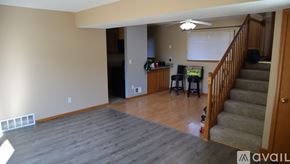 Eagan apartment for rent - A living room with a staircase leading to the upper floor.