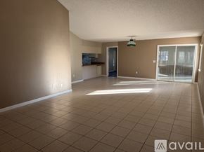 Palm Coast house for rent - A kitchen with a wooden countertop and white cabinets.