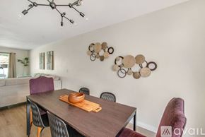 Aliso Viejo house for rent - A dining room with a wooden table and chairs.