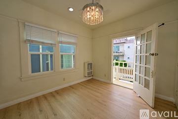 Los Angeles apartment for rent - A white kitchen with a gas stove and a window.