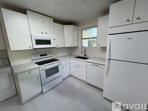 St. Augustine apartment for rent - A kitchen with white appliances and cabinets.