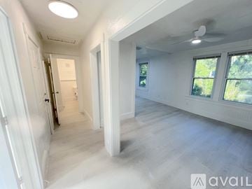 St. Augustine apartment for rent - A kitchen with white appliances and a dining table with chairs.
