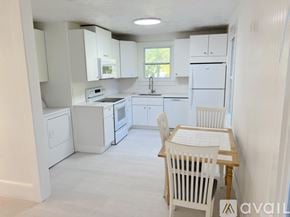 St. Augustine apartment for rent - A house with a large yard and trees in front.