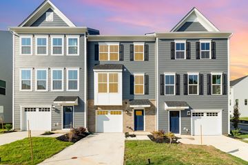 Charlotte apartment for rent - A modern two-story house with a garage on the ground floor.
