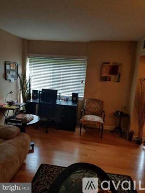 District Heights apartment for rent - A living room with a couch, chair, and television.