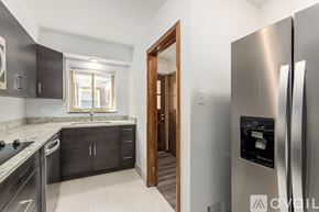Columbus townhouse for rent - A modern kitchen with a refrigerator on the right.