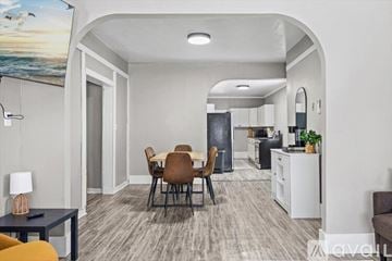Sturgis apartment for rent - A kitchen with white cabinets and a black countertop.
