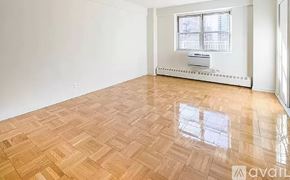 New York apartment for rent - A room with wooden flooring and a window.