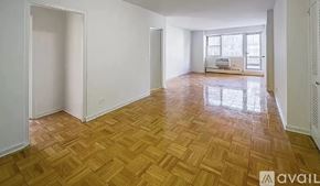 New York apartment for rent - A room with wooden flooring and white walls is available for rent.