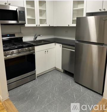New York apartment for rent - A kitchen with a stainless steel refrigerator and oven.