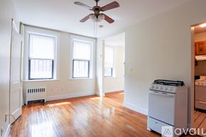 Boston apartment for rent - A room with a fan, a stove and a radiator.