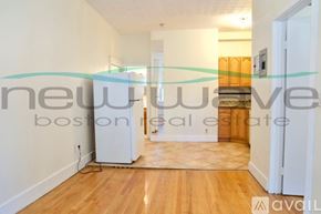 Boston apartment for rent - A room with wooden flooring and white walls is available for rent.