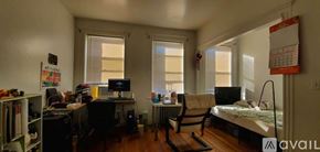 Boston apartment for rent - A small room with a bed, desk, and chair.