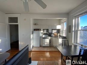 Boston apartment for rent - A kitchen with a refrigerator, stove, and sink.