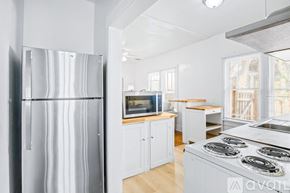 St. Petersburg apartment for rent - A kitchen with a stainless steel refrigerator and stove.