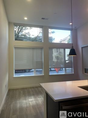 Denver apartment for rent - A kitchen area with a counter and a window.