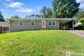 Atlanta house for rent - A house with a green lawn in front of it.