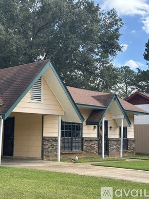 Jackson house for rent - A house with a brown roof and a green trim.