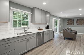 Asheville house for rent - A modern kitchen with a sink and a window.