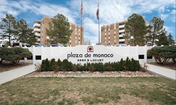Denver apartment for rent - Plaza de Monaco sign in front of a building.
