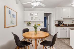 Fullerton apartment for rent - A dining room with a round table and chairs.