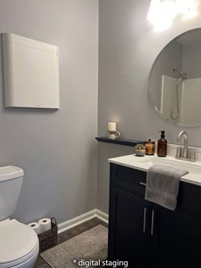 Lexington apartment for rent - A bathroom with a toilet, sink, and mirror.