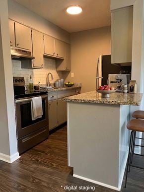 Lexington apartment for rent - A kitchen with a white island and brown bar stool.