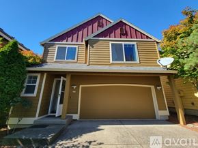 Beaverton house for rent - A house with a brown and beige exterior and a red roof.