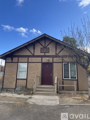 Twin Falls apartment for rent - A small house with a brown door and a brown roof.