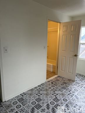 Twin Falls apartment for rent - A room with a white door and a tiled floor.