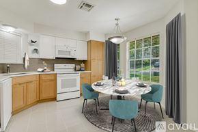 Austin townhouse for rent - A modern kitchen with a dining table set for two.