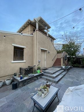 San Ramon house for rent - A patio area with a table, chairs, and potted plants.