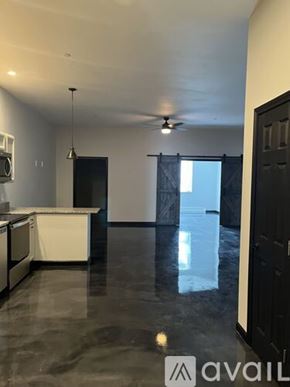 Littleton apartment for rent - A spacious kitchen with a marble floor and a ceiling fan.