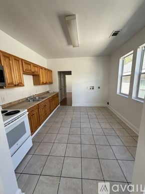 New Orleans apartment for rent - A room with wooden flooring and white walls.
