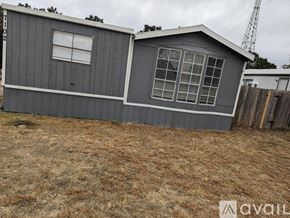 Lago Vista house for rent - A grey house with a white window is available for rent.