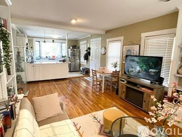 Chelmsford condo for rent - A living room with a television and a couch.