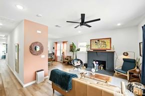 San Antonio house for rent - A living room with a fireplace and a blue blanket on the couch.