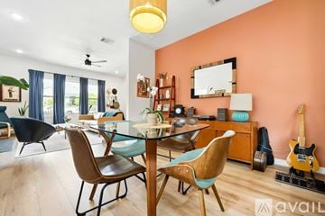 San Antonio house for rent - A living room with a dining table and chairs.