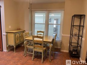 Mount Pleasant house for rent - A dining room with a table and chairs.