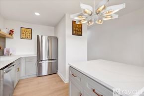 Homewood condo for rent - A kitchen with a stainless steel refrigerator and a white ceiling fan.