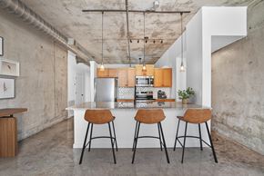Atlanta apartment for rent - A kitchen with a white counter and two bar stools.