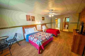 Buchanan house for rent - A room with two beds and a chair.