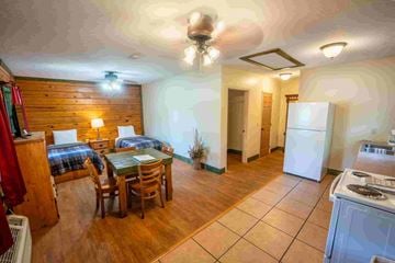 Buchanan apartment for rent - A kitchen with a dining table and chairs is visible.