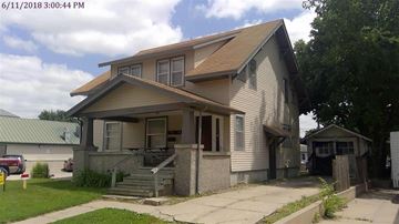 Kearney apartment for rent - A house with a brown roof and a grey wall.