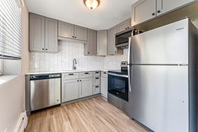 Denver apartment for rent - A kitchen with a refrigerator, dishwasher, and oven.
