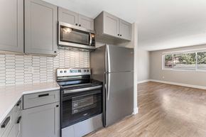 Denver apartment for rent - A kitchen with a stove, oven, and microwave.