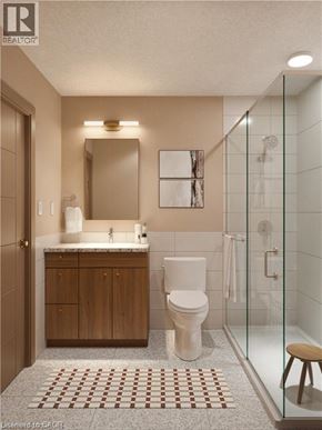 Waterloo condo for rent - A bathroom with a toilet, sink, and shower.